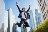 Business Person Jumping in Air